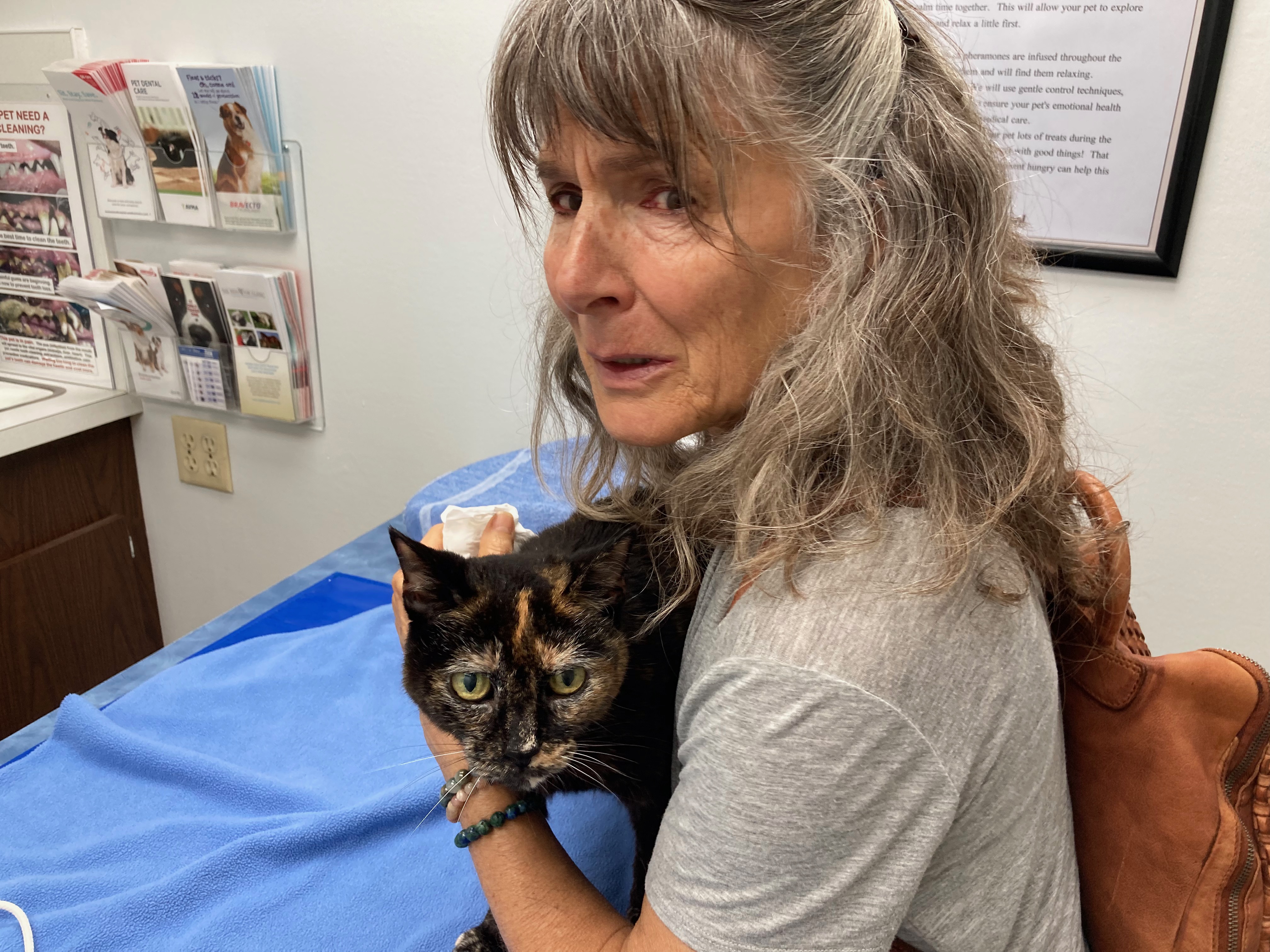 Tracy holding Jasper at vet office 